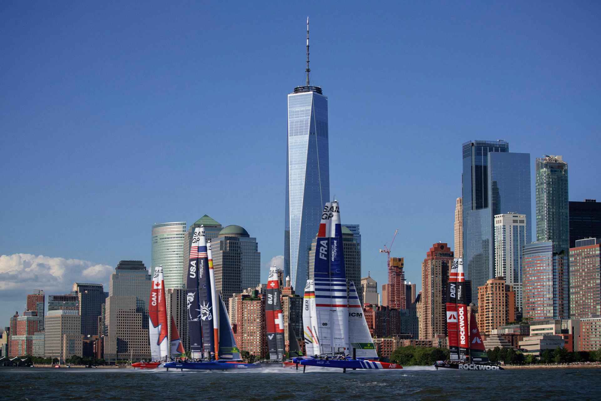 Sailboats competing in Sail GP near Manhattan skyline